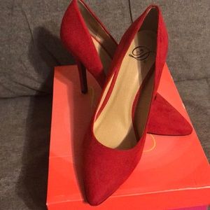 Red suede pumps
